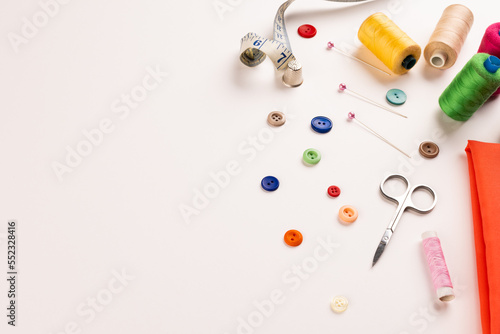 Composition of sewing equipment on white background