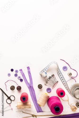 Composition of sewing equipment on white background