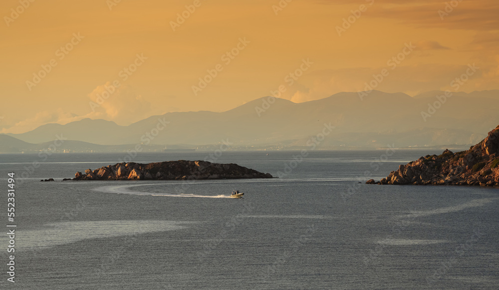 Seaside landscape from Aegean Sea and Saronic Gulf during a beautiful autumn sunset