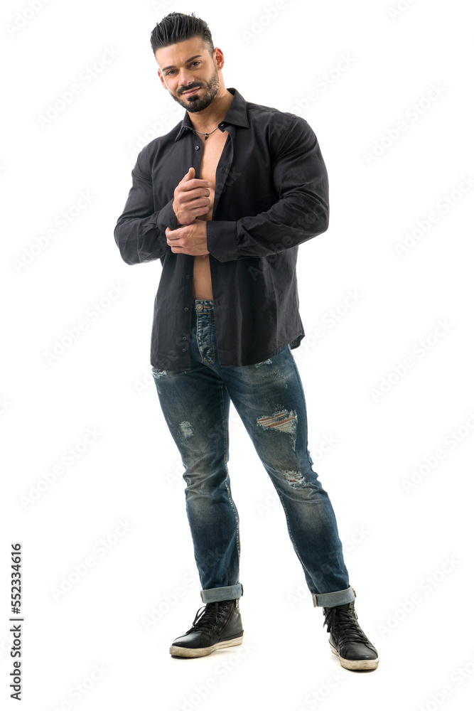 Muscular bodybuilder undressing, opening shirt on nude torso Muscular bodybuilder undressing, opening shirt on nude torso