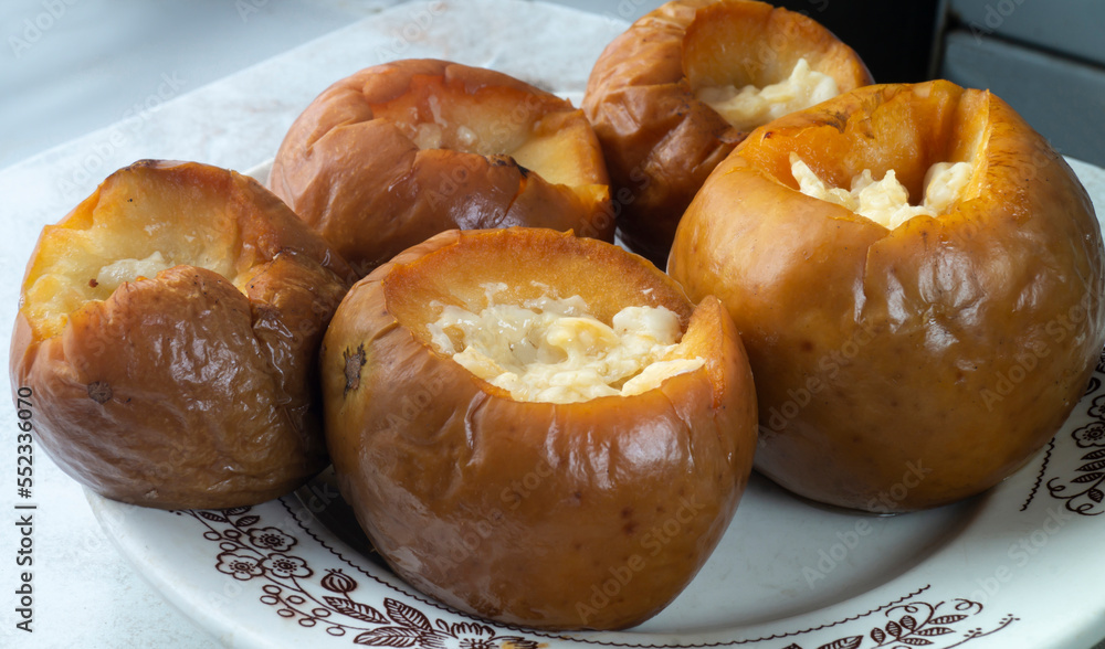 Baked apples with honey on the table Baked apples with honey on the table