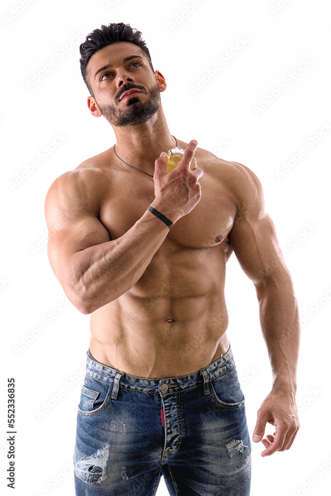 Shirtless Male Model Spraying Cologne On White Background Stock Photo shirtless-male-model-spraying-cologne-on-white-background-stock-photo
