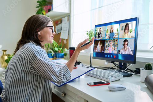 Female teacher working at home, online lesson with group of teenage students