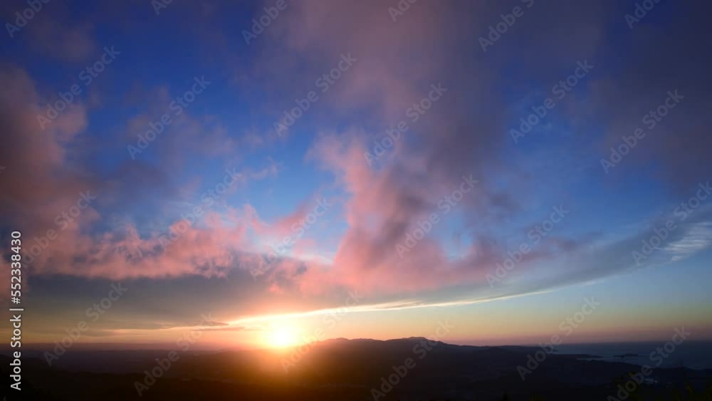Enjoy a romantic colorful sunset from the top of the mountain. Blue sky orange evening sunset. Wufen Mountain, Ruifang District, New Taipei City, Taiwan Enjoy a romantic colorful sunset from the top of the mountain. Blue sky orange evening sunset. Wufen Mountain, Ruifang District, New Taipei City, Taiwan