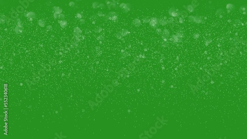 Falling snow isolated on green. Loop 4k, Chroma key. High quality 4k footage