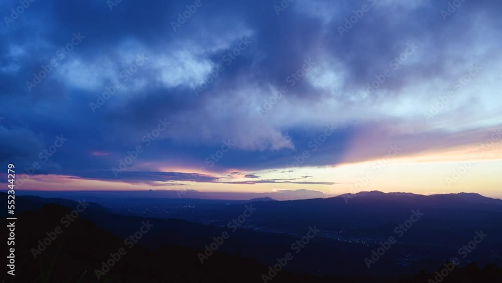 Enjoy a romantic colorful sunset from the top of the mountain. Blue sky orange evening sunset. Wufen Mountain, Ruifang District, New Taipei City, Taiwan Enjoy a romantic colorful sunset from the top of the mountain. Blue sky orange evening sunset. Wufen Mountain, Ruifang District, New Taipei City, Taiwan
