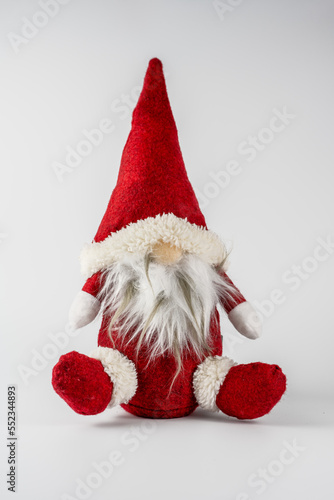 Father Christmas nordic woollen gnome ornament with long beard isolated on a white background photo