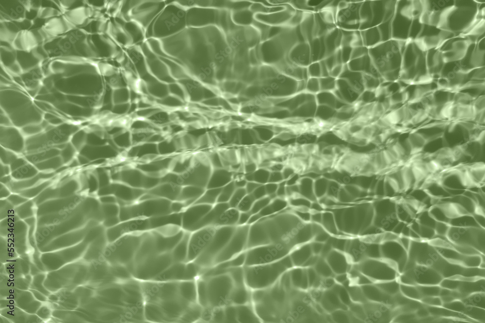 Bluewater waves on the surface ripples blurred. Defocus blurred transparent blue colored clear calm water surface texture with splash and bubbles. Water waves with shining pattern texture background. Bluewater waves on the surface ripples blurred. Defocus blurred transparent blue colored clear calm water surface texture with splash and bubbles. Water waves with shining pattern texture background.