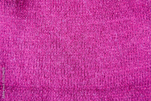 Pink linen texture for the background. Bright redviolet knitted texture photo