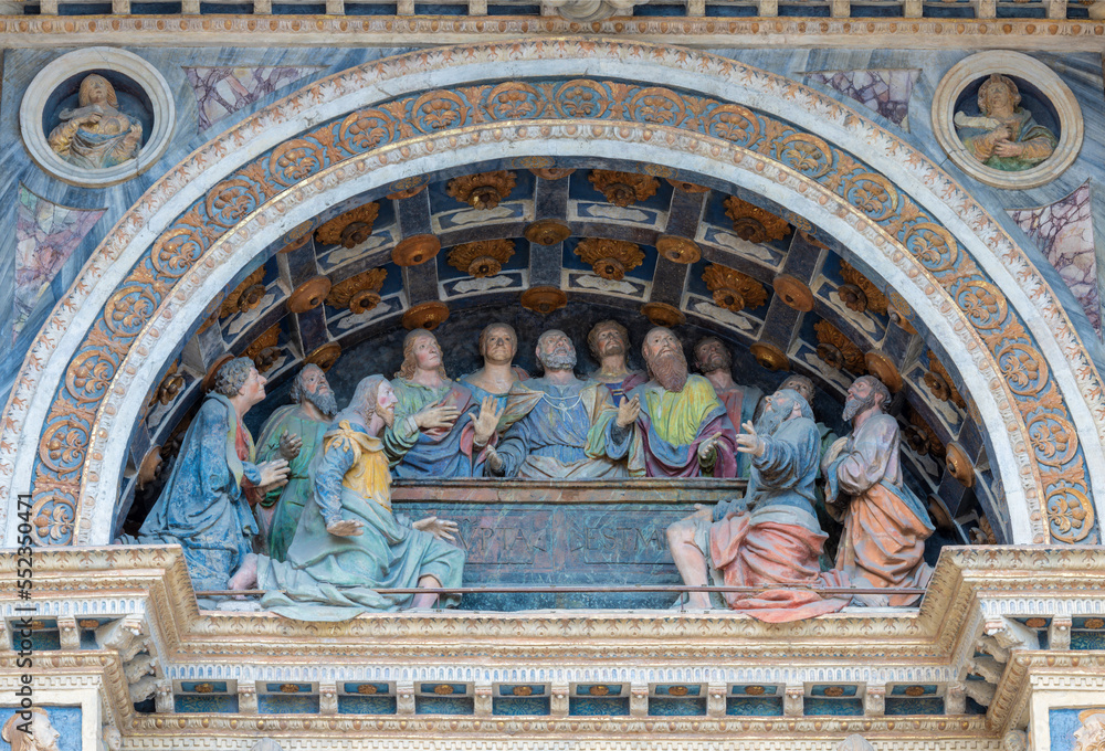 AOSTA, ITALY - JULY 14, 2018: The Statue of apostles at the Assumption - detail of facade of Santa Maria Assunta Cathedral from 16. cent.