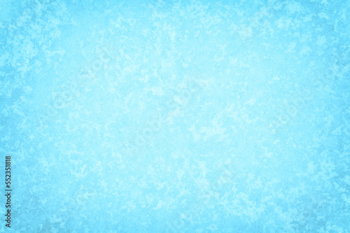 Frozen icy window with the texture of a pattern of white frost. Background concept