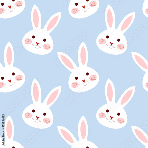 Seamless pattern with rabbit face on a blue background.