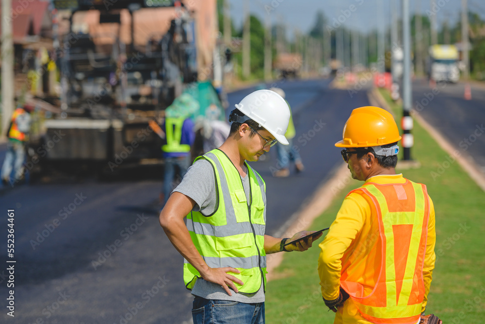 Male civil engineer working at paved road construction site Control and inspect the quality of paved road construction projects. Male civil engineer working at paved road construction site Control and inspect the quality of paved road construction projects.