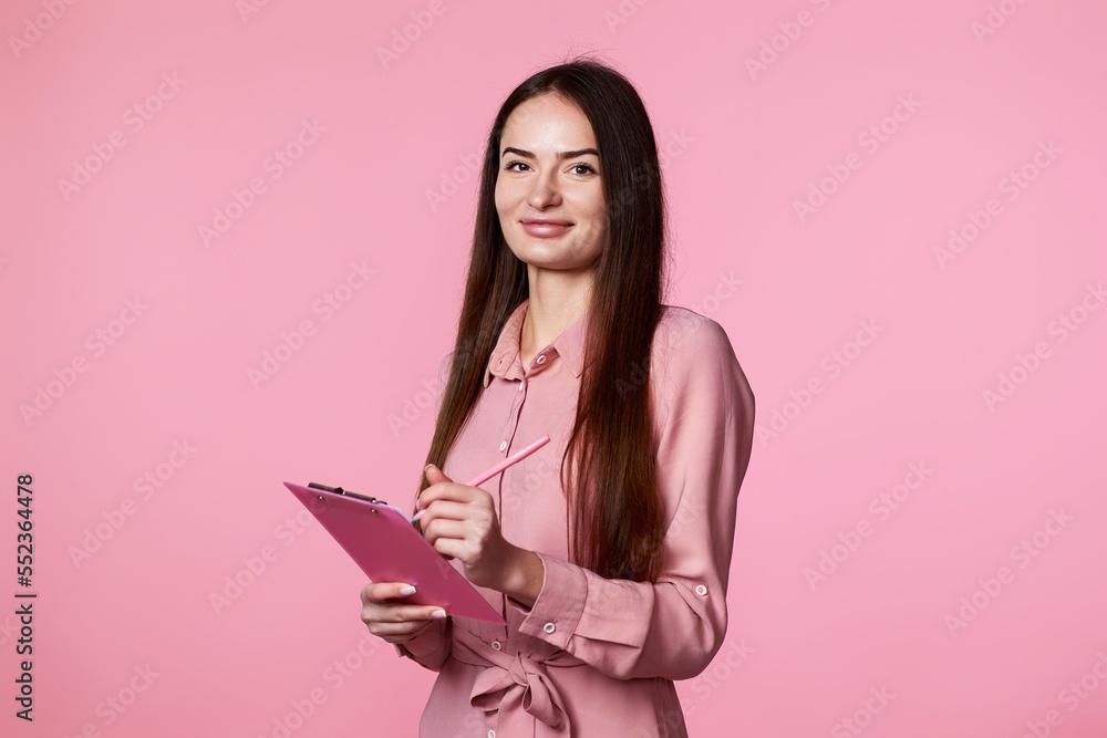 young woman holding clipboard with papers document young woman holding clipboard with papers document