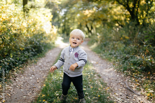 happy family playing and laughing in autumn park