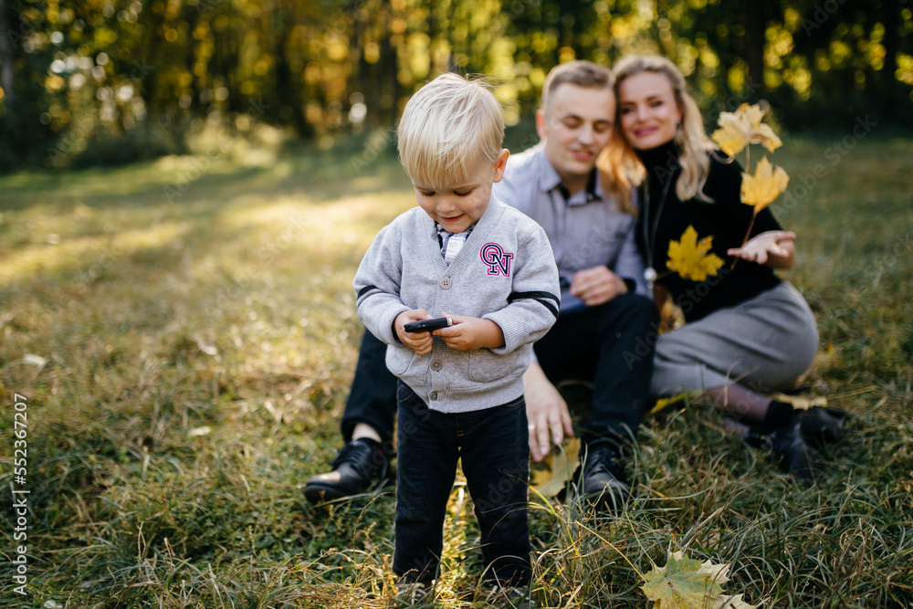 happy family playing and laughing in autumn park happy family playing and laughing in autumn park
