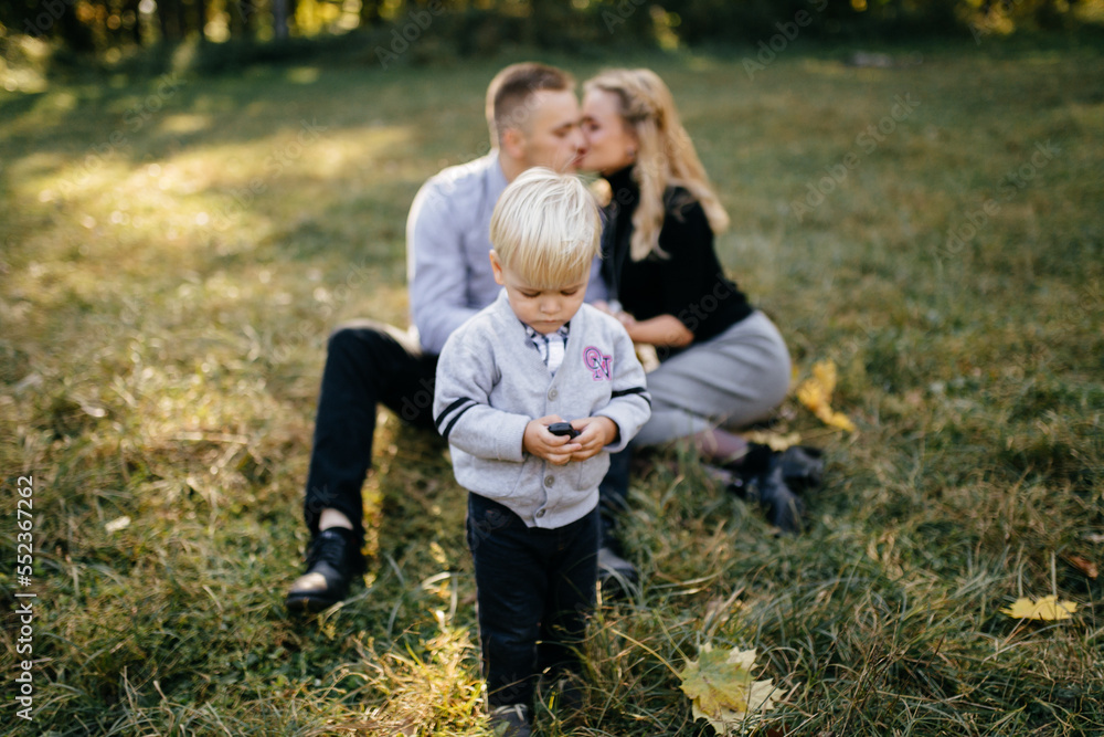 happy family playing and laughing in autumn park