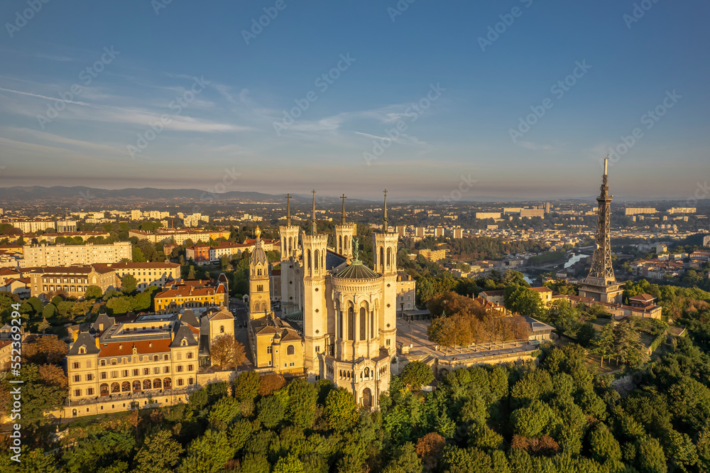 The drone panoramic view of The Basilica of Notre-Dame de Fourvière and Metallic tower on the top of hill. Lyon, France. 