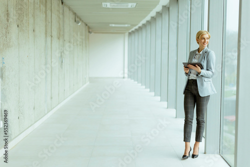 Businesswoman using digital...
