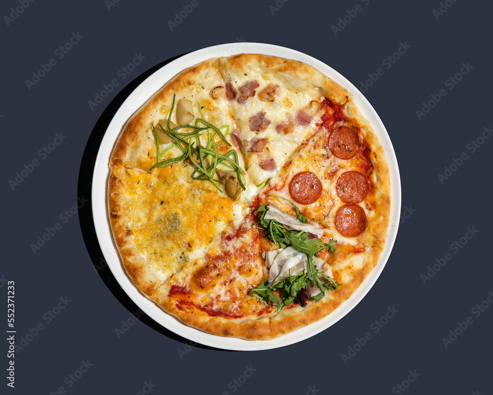 Four different pizzas in one top view closeup isolated on blue background Four different pizzas in one top view closeup isolated on blue background