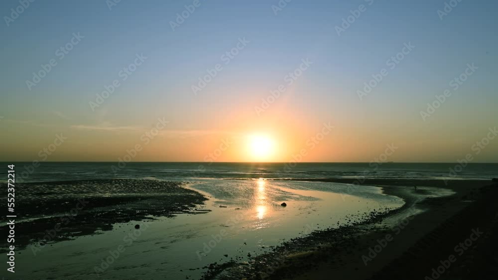 A complete record of the sunset horizon. The river flows into the sea. Xinwu District, Taoyuan City, Taiwan A complete record of the sunset horizon. The river flows into the sea. Xinwu District, Taoyuan City, Taiwan