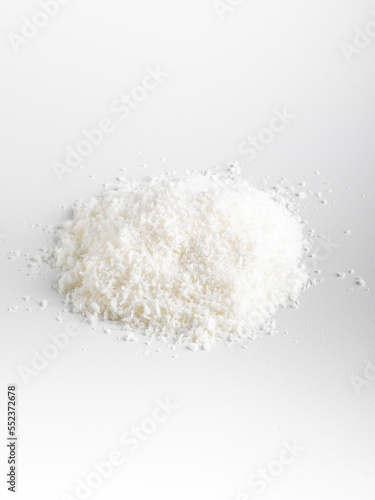 Heap of coconut closeup isolated on white background