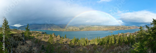 Rainbow and rain clouds over Columbia River Gorge in Oregon.
