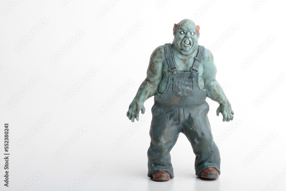 miniature figurine of a zombie doll on a white background miniature figurine of a zombie doll on a white background