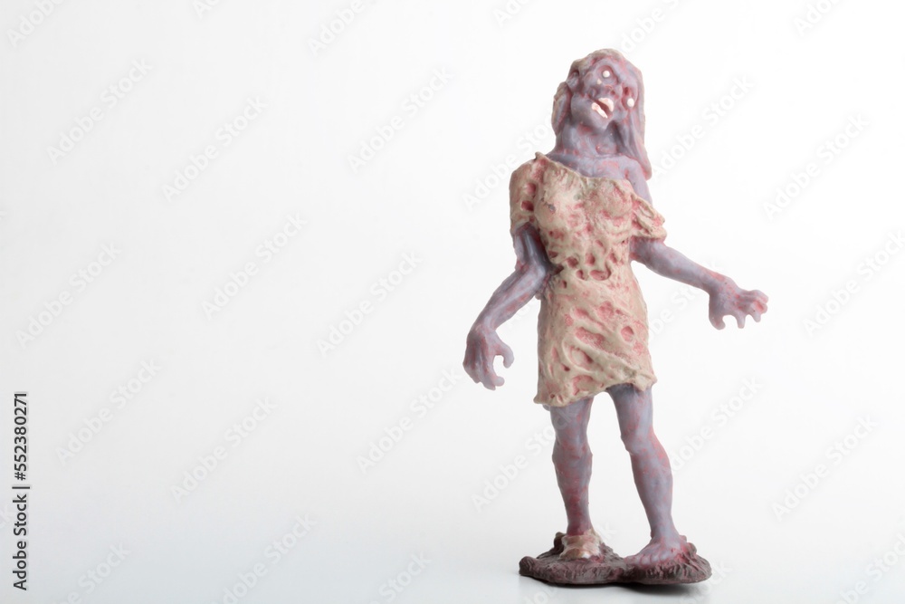 miniature figurine of a zombie doll on a white background