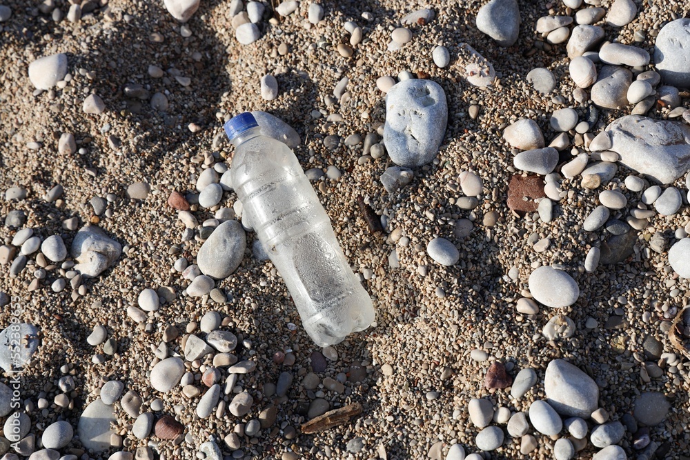 plastic bottle on the beach or shore.
ecological concept
plastic bottle on the beach or shore.
ecological concept