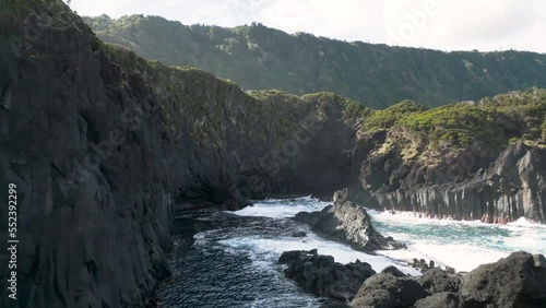 Flight over scenic coast with volcanic rock, Fajã do Ouvidor in São Jorge, Azores photo