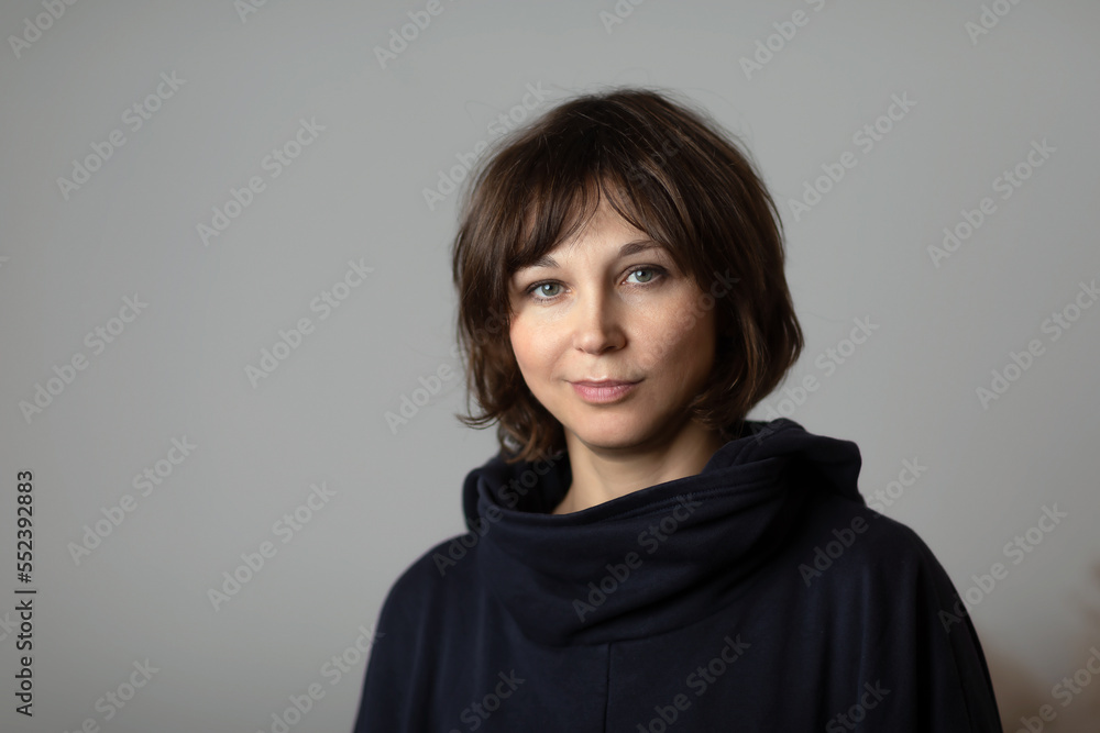 Portrait of woman over 40 years old. Close-up, look into camera Portrait of woman over 40 years old. Close-up, look into camera
