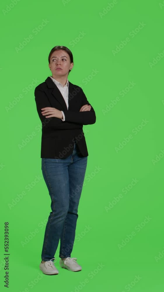 Vertical video: Side view of impatient office worker waiting and being late, standing over full body green screen background. Young businesswoman wait, wearing suit on studio isolated greenscreen Vertical video: Side view of impatient office worker waiting and being late, standing over full body green screen background. Young businesswoman wait, wearing suit on studio isolated greenscreen