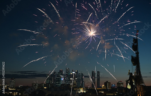 July 29, 2022, Moscow, Russia. Fireworks over the monument to Peter the Great and Moscow City skyscrapers on a summer evening.
