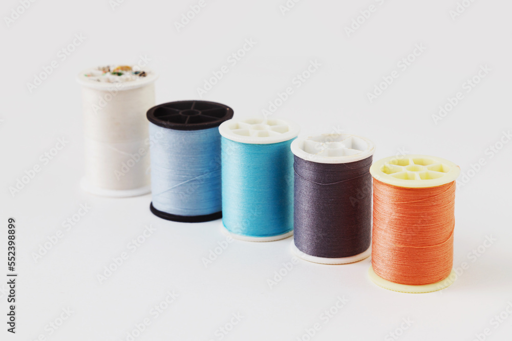 Yarn textile, Spool of colorful clothes sewing thread isolated on white Yarn textile, Spool of colorful clothes sewing thread isolated on white