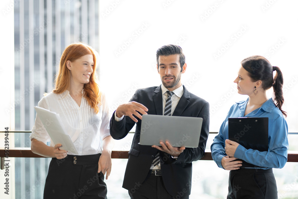 business meeting. happy business team with laptop computers, Businesspeople discussing together. meeting at office. Office colleagues having casual discussion during meeting. Business, technology business meeting. happy business team with laptop computers, Businesspeople discussing together. meeting at office. Office colleagues having casual discussion during meeting. Business, technology