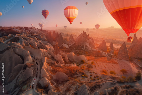 Tour excursion on horse autumn landscape with hot air balloons in Cappadocia Turkey top aerial view