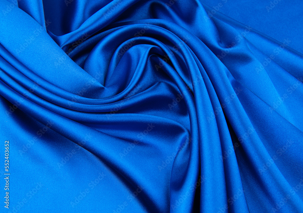 Blue satin or silk fabric as background Blue satin or silk fabric as background