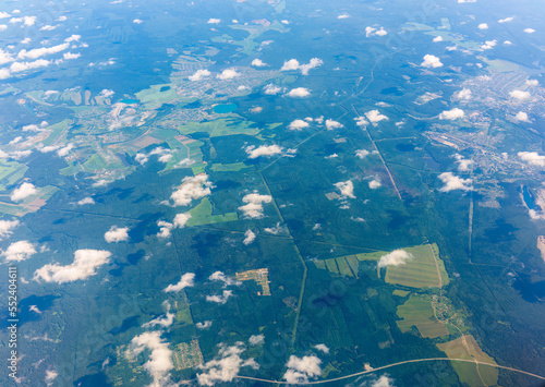 Fotografie Aerial view from airplane window above green ground