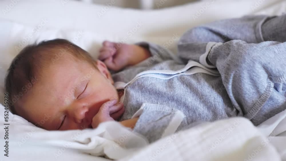 newborn baby sleeping. happy family a maternity hospital hospital kid dream concept. newborn close-up. little lifestyle girl baby sleeps dark-haired brunette at home in bed newborn baby sleeping. happy family a maternity hospital hospital kid dream concept. newborn close-up. little lifestyle girl baby sleeps dark-haired brunette at home in bed