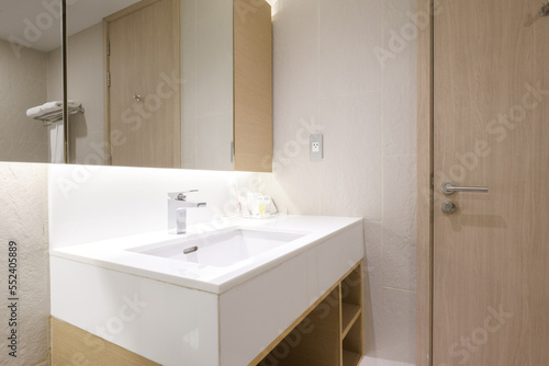 Loft white tile bathroom corner  tub and sink