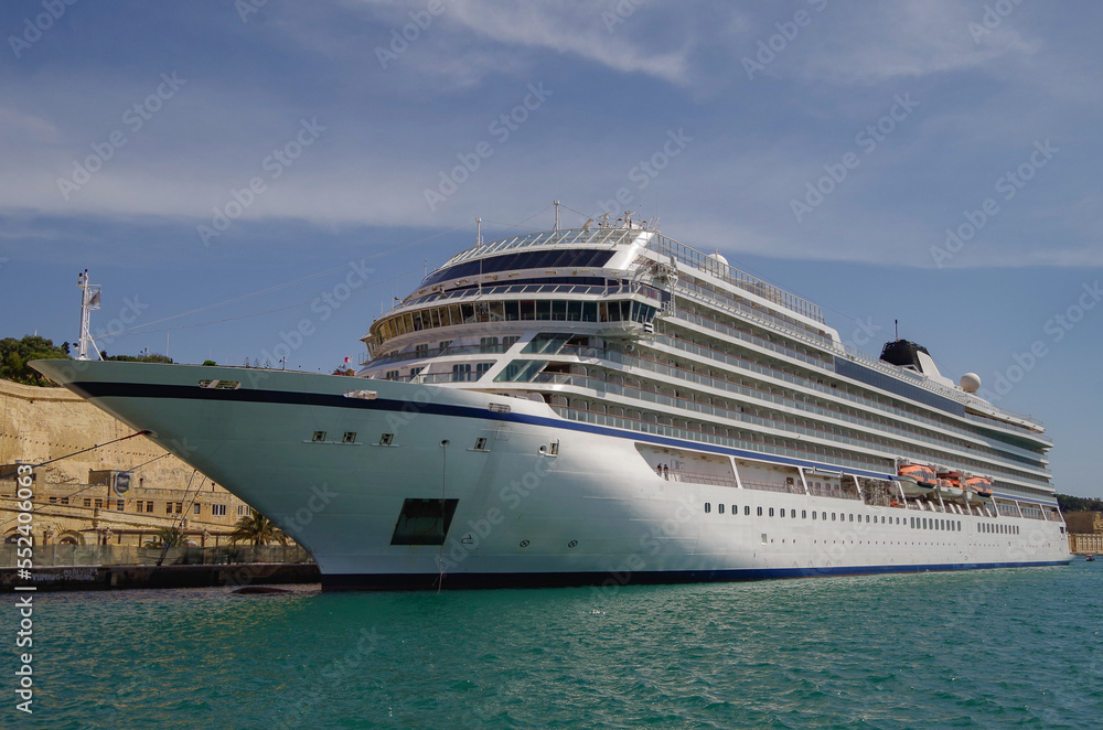 Viking luxury cruiseship or cruise ship liner Star in La Valletta, Malta port during Mediterranean cruise dream vacation	on sunny day blue sky and historic old town skyline