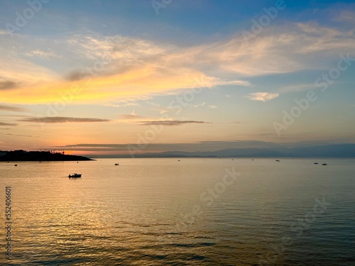 Seascape after the sunset, orange clouds at the seascape, golden hour © Oksana