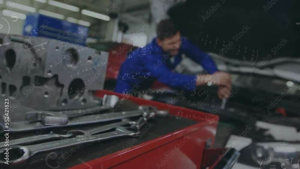 Animation of statistics and data processing over man fixing car Animation of statistics and data processing over man fixing car