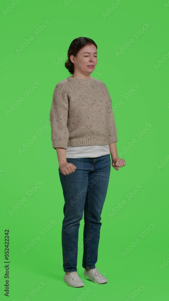Vertical video: Side view of tired girl yawning in studio, posing over green screen background. Young adult being exhausted and sleepy standing over isolated full body greenscreen backdrop, falling Vertical video: Side view of tired girl yawning in studio, posing over green screen background. Young adult being exhausted and sleepy standing over isolated full body greenscreen backdrop, falling
