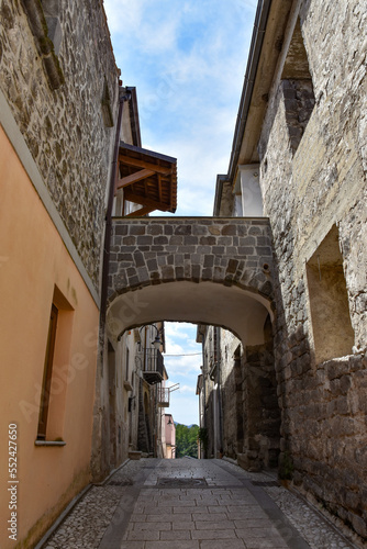 Fototapeta Naklejka Na Ścianę i Meble -  A narrow street between the houses of Ruviano, a small village in the province of Caserta in Italy.
