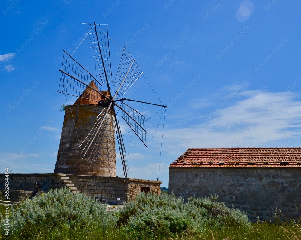 Windmill in the Saline di Trapani e Paceco natural reserve near Trapani, Sicily, Italy.