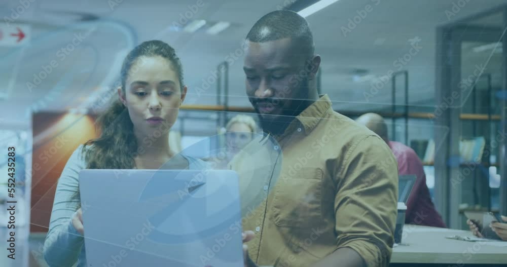 Animation of data processing over diverse business people in office Animation of data processing over diverse business people in office