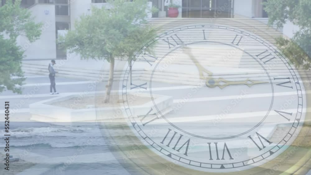 Animation of clock rotating over aerial view of trees growing on city street by buildings