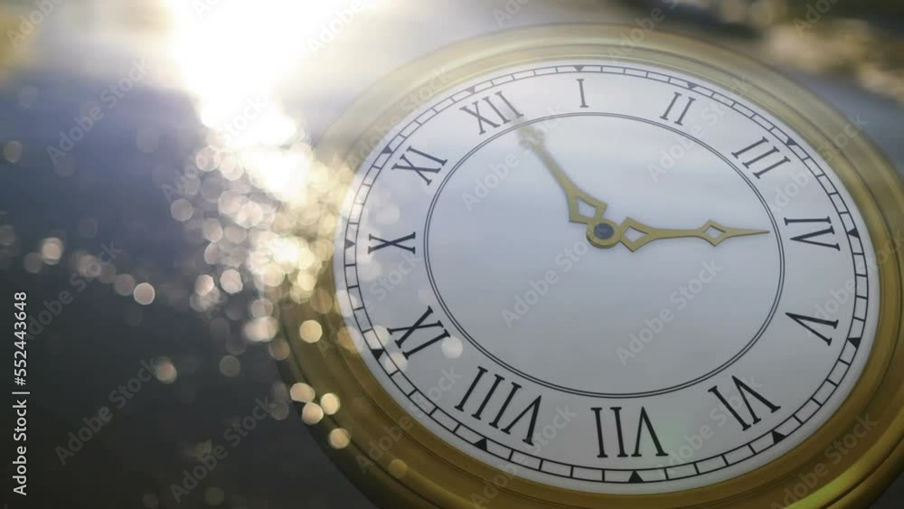 Animation of happy new year text over clock with periodic motion against low angle view of seashore